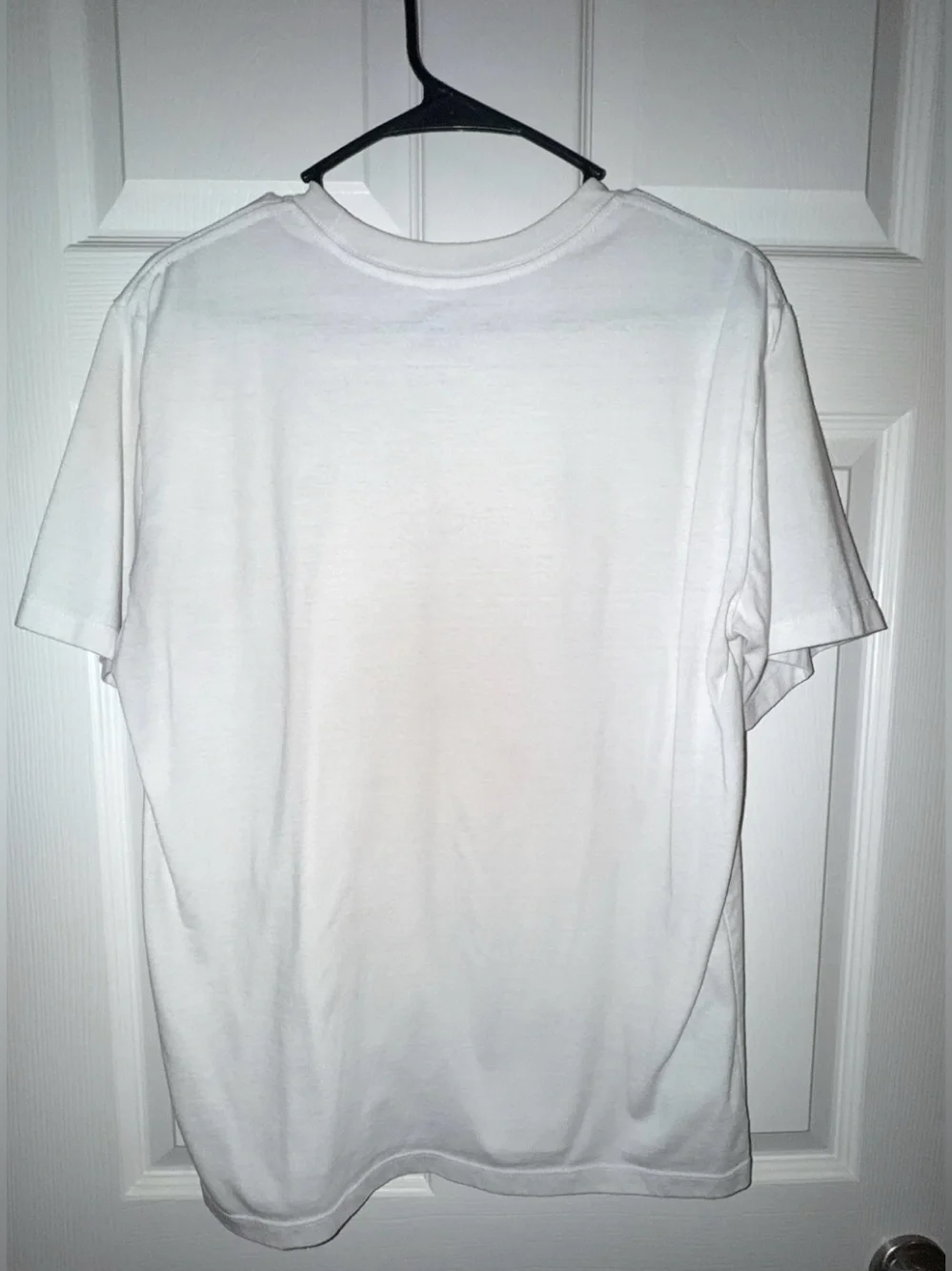 The North Face White Short Sleeve Tee with Black Ski Graphic